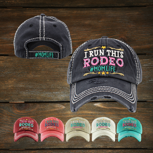 This timeless I Run This Rodeo #MOMLIFE hat is perfect for everyday wear. It features a classic vintage washed look, for added style and attitude, perfect for expressing your #MomLife spirit. With the pre-curved bill and adjustable Velcro back closure, you have maximum comfort and adjustability.